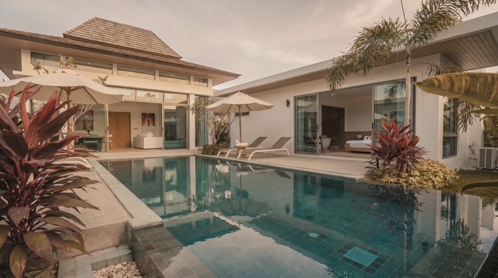 Private villa terrace lit at dusk in Phuket