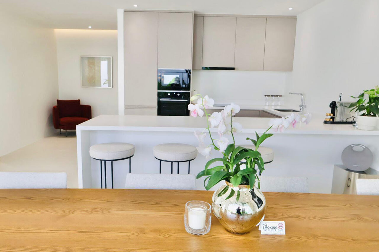Open-plan kitchen and dining area of a Coco Villas home managed by Escape Villas