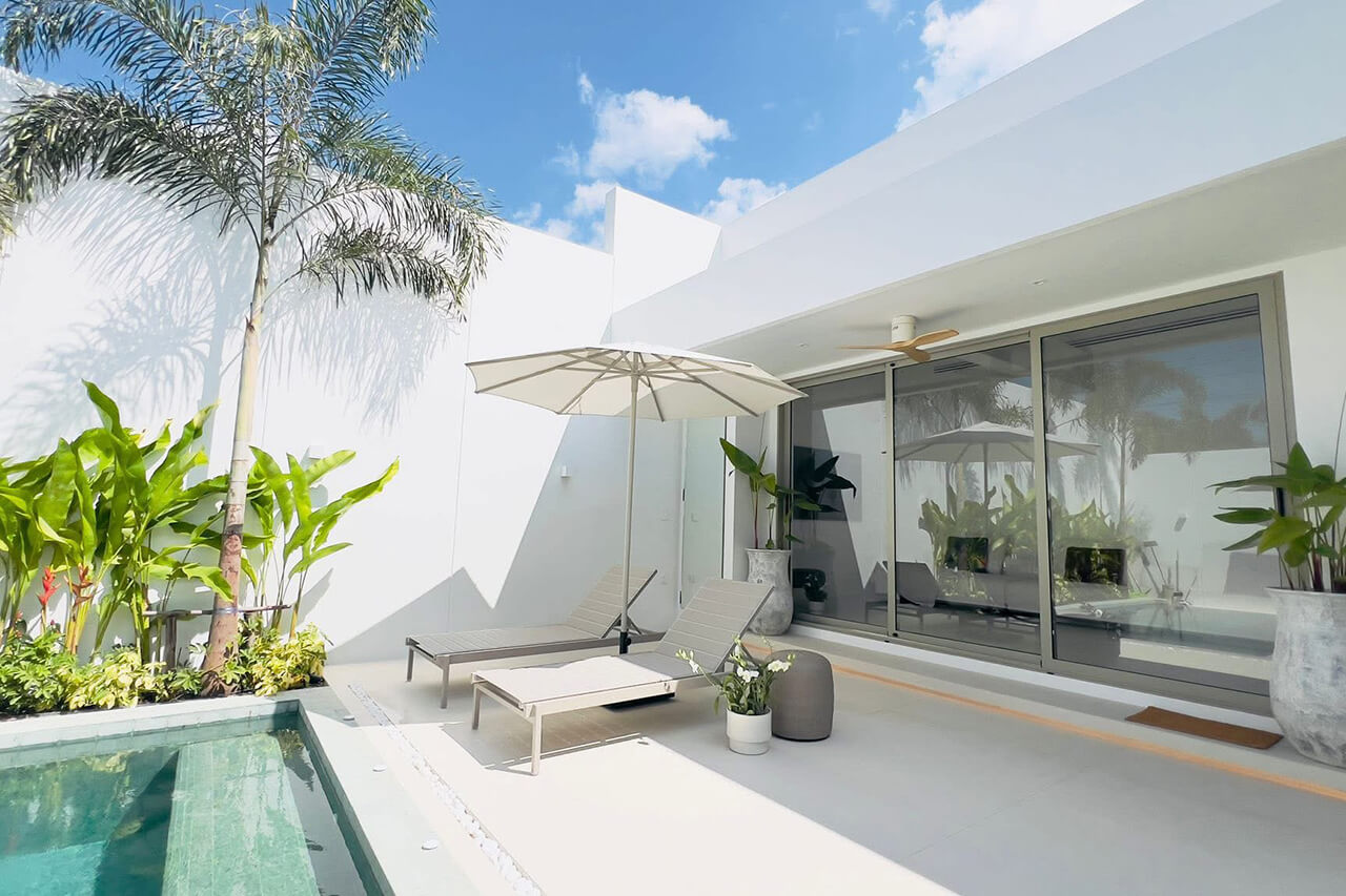 Pool terrace and sliding glass doors of a Coco Villas home in Pru Champa